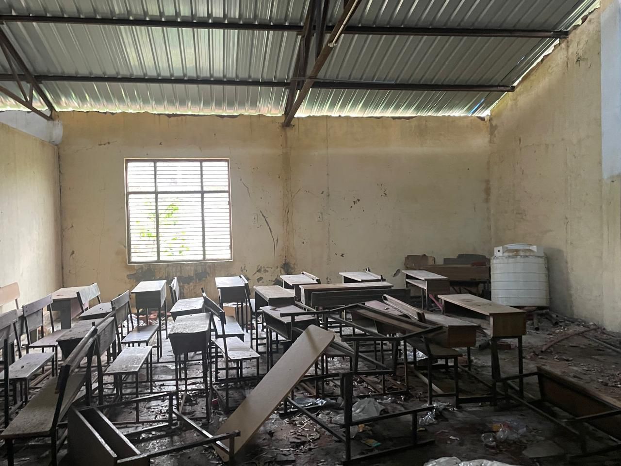 A dilapidated classroom before renovation.